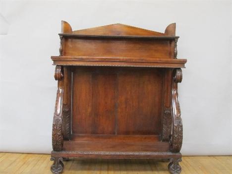 A William IV rosewood consul table with architectural panelled back supporting a single shelf on baluster turned supports, th