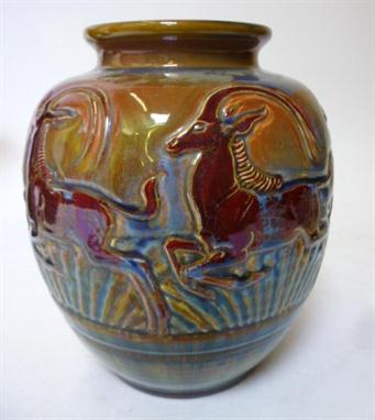 A PILKINGTON`S ROYAL LANCASTRIAN EARTHENWARE VASE designed by Richard Joyce, of baluster form, moulded with a band of five ru