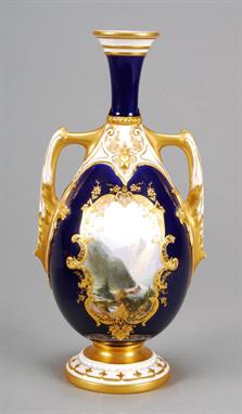 A Royal Worcester two-handled mazarine-blue ground vase, decorated with a Canadian style mountain landscape in the style of H