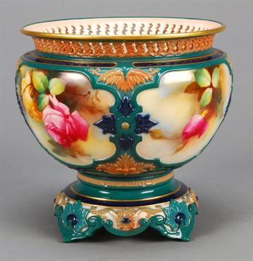 A Royal Worcester Hadley Ware jardiniere and integral stand, painted with panels of roses by H. Martin, 19.5cm high, date cod