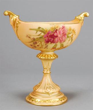 A Royal Worcester blush-ivory ground navette-shaped pedestal vase, decorated with carnations in the style of Frank Roberts, 1