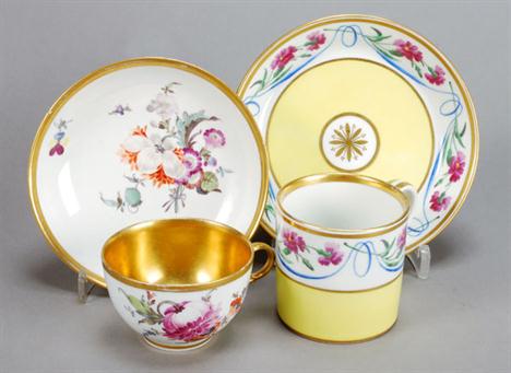 A Furstenberg gilt-lined coffee cup and saucer, painted with deutsche Blumen, script F mark, late 18th century; and a Vienna 