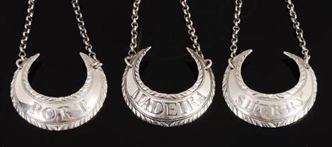 Three George III silver crescent shaped wine labels by Hester Bateman, two with maker&#8217;s and standard marks, one with tw