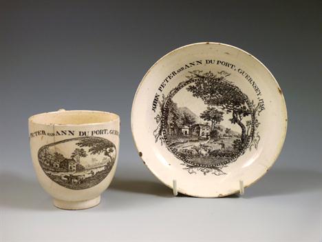 A Coffee Cup and Saucer, 1786, with JOHN PETER AND ANN DU PORT, GUERNSEY, 1786, cup impressed WEDGWOOD &amp; CO, cracks, chip