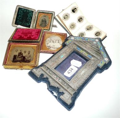 Continental silver and cloisonne enamel architectural photograph frame, small album of portrait photographs and three cased d