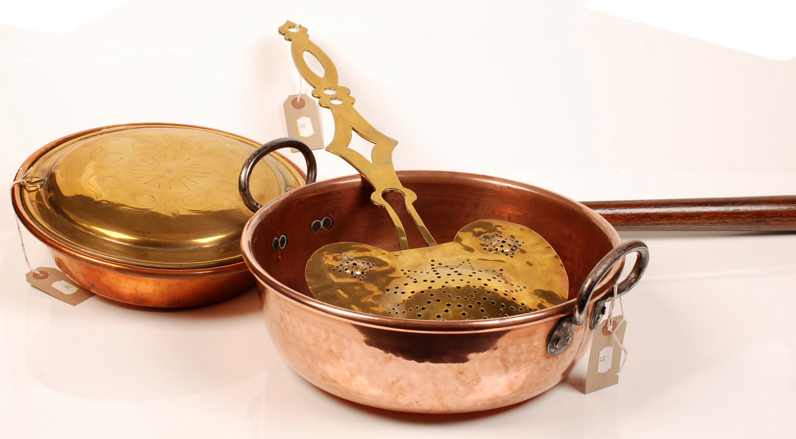 A brass chestnut roaster and copper warming pan with brass lid, together with a copper preserve p