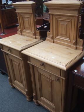 A pair of Continental pine small cabinets, with architectural ledge back, single drawer and cupboard, 52 cm wide. 