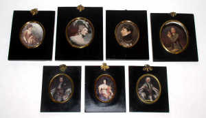 A selection of seven early 19th century oval portrait miniature frames, each with gilt bezel moun