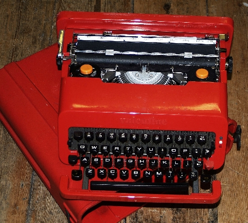 An Olivetti `Valentine` typewriter, circa 1970, designed by Ettore Sottsass, bright red with oran