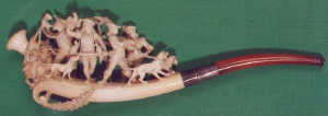 A FINE MEERSCHAUM CIGAR PIPE, C19th, carved in full relief with hawking party, with silver colour