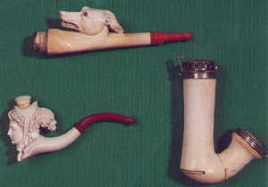A Debrecen meerschaum pipe bowl, with silver coloured metal mounts and decorative pierced lid, bo