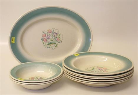 Nine Susie Cooper bowls and an oval plate. 