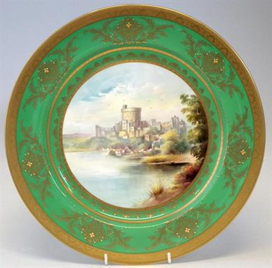 Minton plaque signed A. Holland painted with Windsor Castle within a green and raised gilded border, printed marks to base, 3