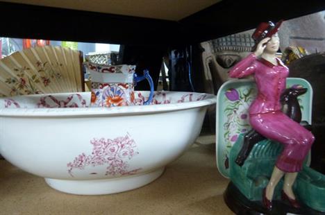 A ceramic washing bowl, Masons jug and Susie Cooper ceramic figure of woman sitting with dog, number 285 of 1000 
