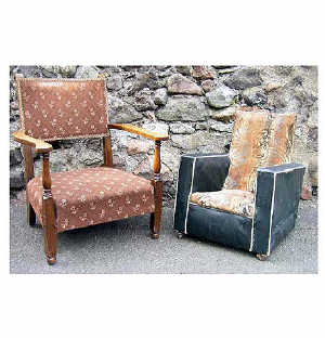 An art deco leatherette and cut moquette upholstered childs armchair, with sprung seat and square platform arms,  raised on c