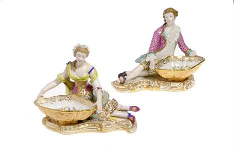 A PAIR OF MINTON SWEETMEAT FIGURES OF A SEATED LADY AND GALLANT WITH BASKETS richly decorated, the baskets painted with frui