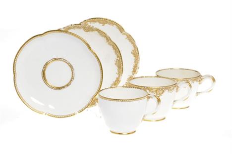 A SEVRES CUP AND SAUCER with entwined gilt handle and dentil rim, 13.5cm diam, painted interlaced Ls in blue, c1760 and a pai