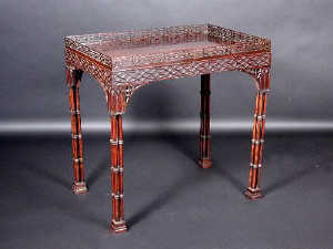 A Chippendale style dalbergia silver table, the rectangular top with pierced gallery above a blind fretwork frieze  supported