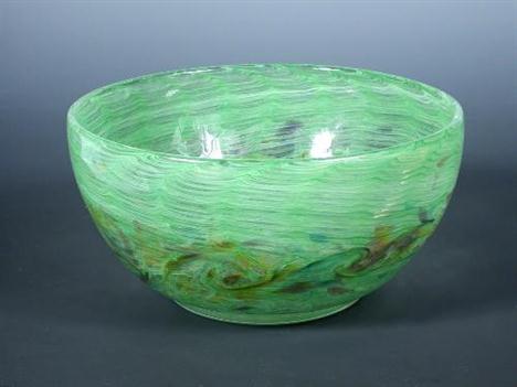 A good Monart glass bowl, with waves of green with purple and yellow tints, original paper label to underside 21.50cm (8.39in