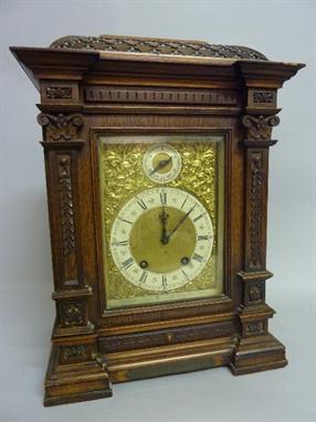 AN F. BUTTERFIELD OF LIVERPOOL BRACKET CLOCK, late 19th Century, carved oak architectural case, gilt dial with silvered chapt