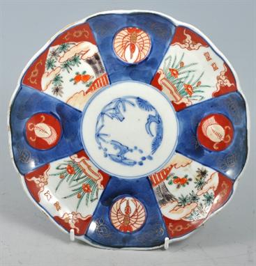 Imari octagonal shaped dish, painted in under-glazed blue and colours, two Imari plates, a Royal Worcester plate and an Atlas