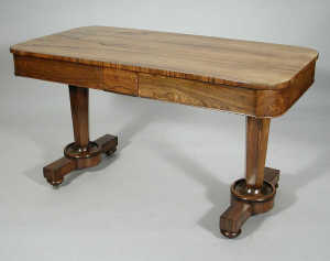 An early Victorian rosewood centre table, the rectangular top above  single blind drawer and alternate verso, on  twin hexago