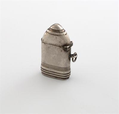 A novelty silver vesta case, by Herbert Hall, Birmingham 1915, modelled as an artillery shell, hinged cover, with a ring atta