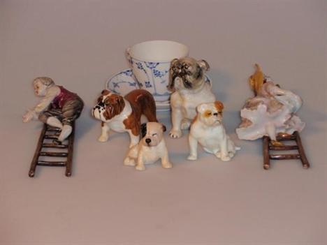 A Beswick bulldog figure, and three others by Arthur Bowker, Royal Doulton and Royal Worcester, and a pair of Capo Di Monte f