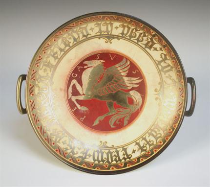 A Pilkington`s Lancastrian lustre pottery two handled centrepiece, circa 1910, decorated by Gordon Forsyth, monogrammed, the 