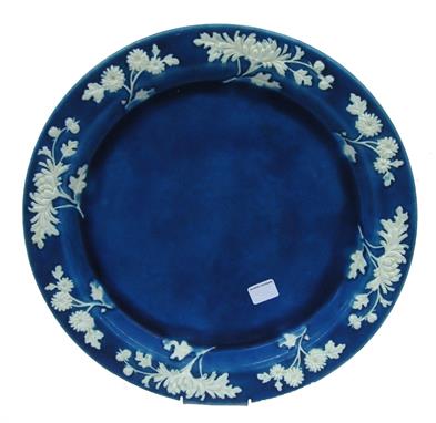 Minton turquoise glazed charger, the raised borders decorated in relief with uncoloured floral sprays, 17&quot; diameter 