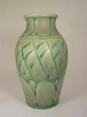 A Royal Lancastrian vase, the centre decorated with green criss- cross design, the neck and base of adjoining oval design on 