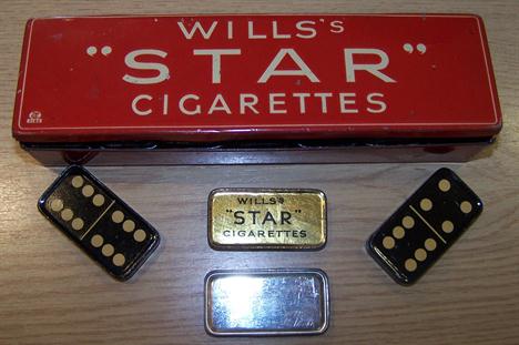 A set of Wills Star Cigarettes Dominoes, each domino formed as a small tin  and in red outer box