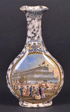 * A Victorian Prattware vase, printed with an exterior view of Crystal Palace, surmounted by Royal crest on a marbled ground,