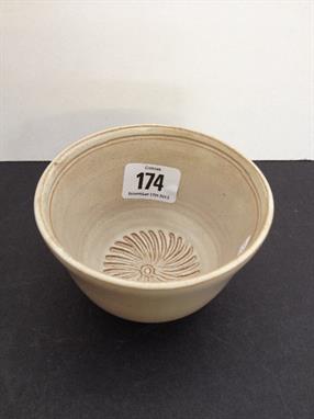 A small Susie Cooper brown glazed sugar bowl within incised decoration, incised marks to base.