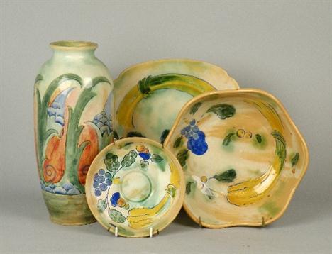 A Royal Doulton Brangwyn Ware vase, the tall baluster vase decorated with a stylised foliate design in green, blue and coral,