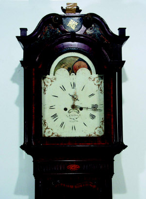 A George III mahogany and boxwood inlaid and crossbanded longcase clock, late 18th century, the b