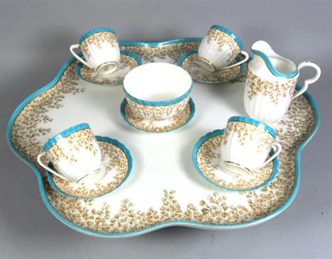 * A Royal Worcester lazy Susan and part tea service, comprising six-lobed revolving lazy Susan, diameter 49.5 cm, a cream jug