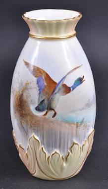 A GOOD ROYAL WORCESTER EARLY 20TH CENTURY VASE painted with a mallard in flight above reeds by James Stinton. C1903. Good con