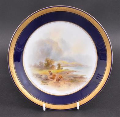 AN EARLY 20TH CENTURY ROYAL WORCESTER CABINET PLATE BY JOHN STINTON painted with a group of cattle in a landscape. Signed. Go