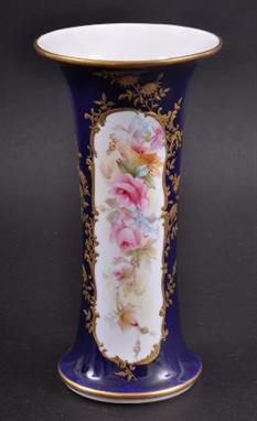 A ROYAL WORCESTER TAPERING VASE BY GEORGE COLE painted with a floral cartouche. Unsigned. Good condition. 7.75ins high. 