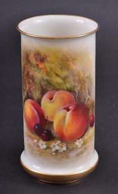 A ROYAL WORCESTER CYLINDRICAL VASE BY WILLIAM RICKETTS formed with a spreading base, painted with peaches and cherries. Signe