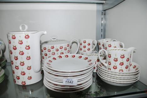 A Susie Cooper 'Apple Gay' Coffee/Tea set with Teapot, Coffee Pot, three Bread and Butter Plates, twelve Side Plates, six Cof