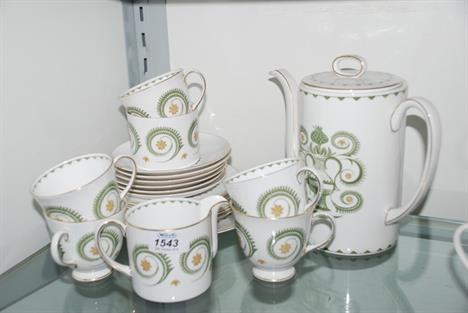 A quantity of Tea and Coffee ware by Susie Cooper in white and green ''Assyrian'' motif pattern, comprising Coffee Pot with l