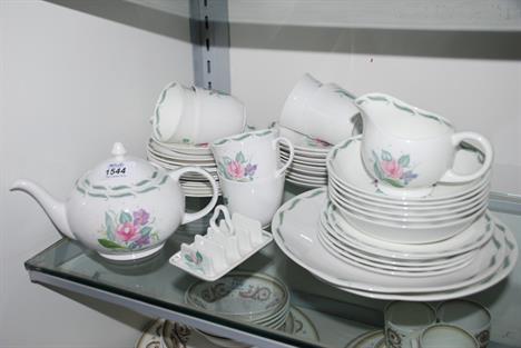 A Susie Cooper 'Fragrance' pattern part Tea Service comprising Teapot, small Toast Rack, six Cups, fifteen side Plates, six F