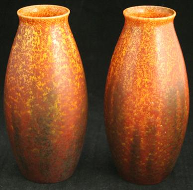 A pair of Pilkington`s Royal Lancastrian ovoid form vases, decorated in a orange vermilion glaze, impressed factory marks and