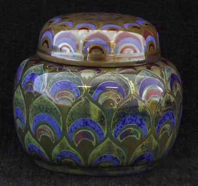 A Pilkingtons Royal Lancastrian lustre ware ginger jar and cover, decorated with peacock feather type motifs, impressed facto