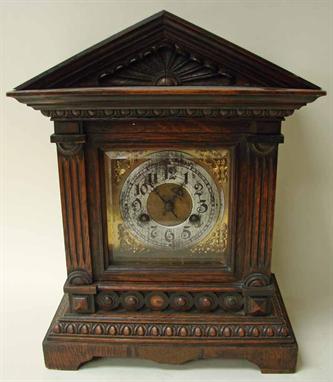 A late Victorian oak mantel clock, in architectural case, 39.5cm high 
