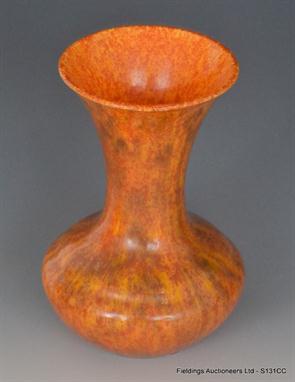 A 1930`s Pilkingtons Royal Lancastrian vase of bulbous form with flared neck decorated in an all over mottled red and brown g