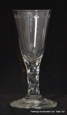 An 18th Century ale glass rounded funnel bowl with OXO border above facet stem and conical foot. 15.5cm high. 