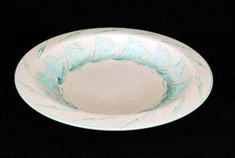 A 1930`s Art Deco Royal Lancastrian charger decorated by Gladys Rogers with mottled jade green triangular pattern band to the